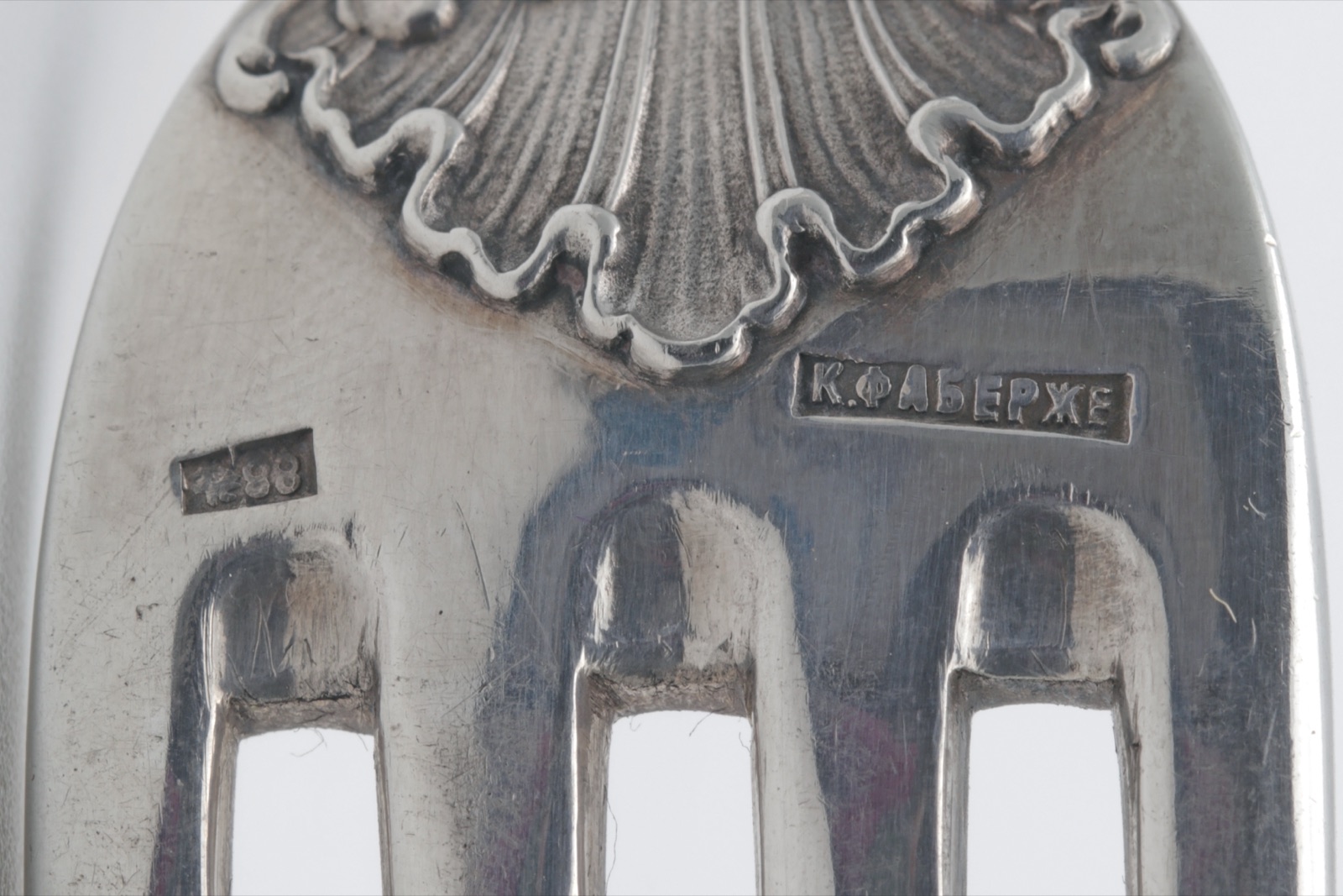 Close-up of a Karl Fabergé maker's mark in Cyrillic stamped on Imperial Russian silver